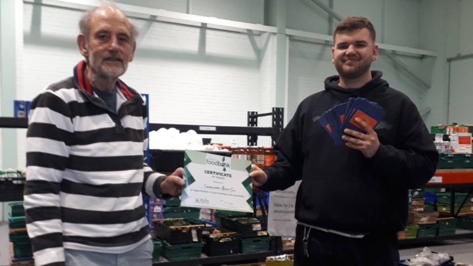 Saddleworth Rotary Club President Ian Brett and Foodbank Manager Tom Lewis-Hood accepting £500 worth of Aldi vouchers on behalf of the Foodbank Saddleworth Rotary Club President Ian Brett and Foodbank Manager Tom Lewis-Hood accepting £500 worth of Aldi vouchers on behalf of the Foodbank