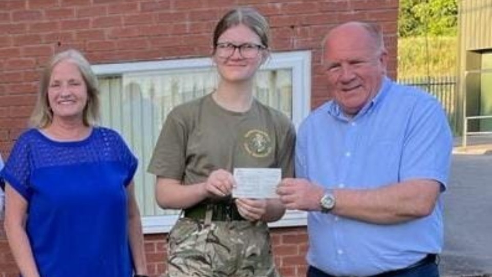 Councillors Dave Arnott and Christine Adams are pictured with one of the army cadets
