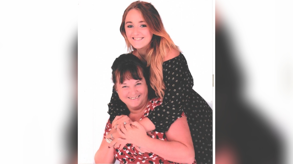 Pictured is Michelle (sat down) with her daughter Pictured is Michelle (sat down) with her daughter