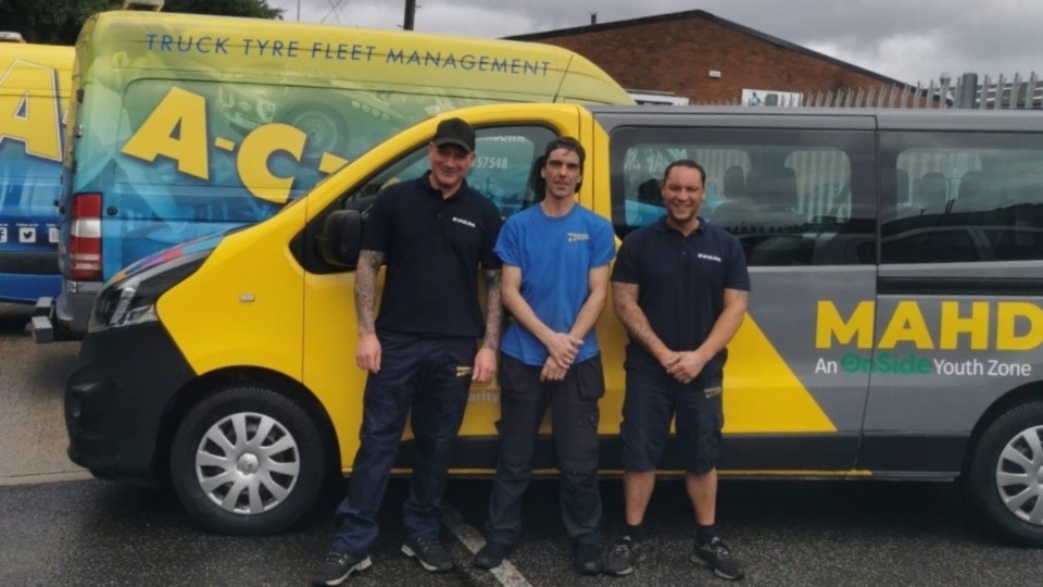 Pictured are technicians from A C Tyres alongside the Mahdlo minibus