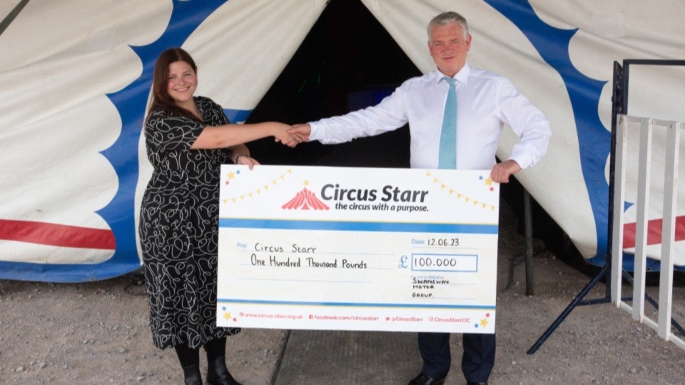 Circus Starr Communications and Engagement Manager Sarah Hall is pictured with Swansway Motor Group Director David Smyth