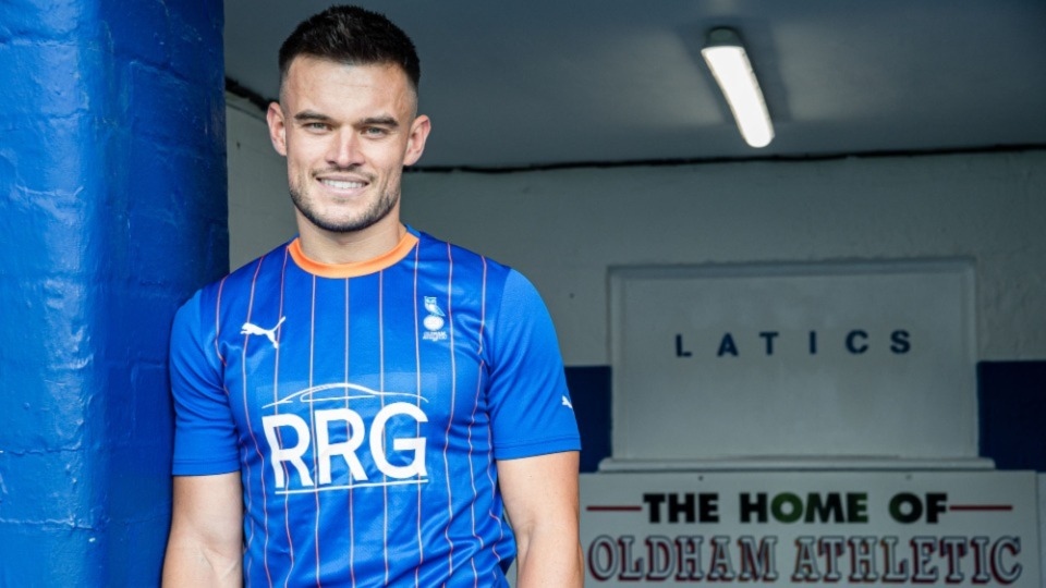 Dan Ward shows off the new Latics shirt