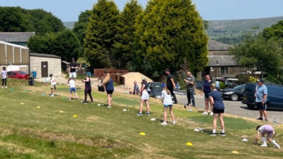 The girls' session is under way on the excellent practice ground at Saddleworth