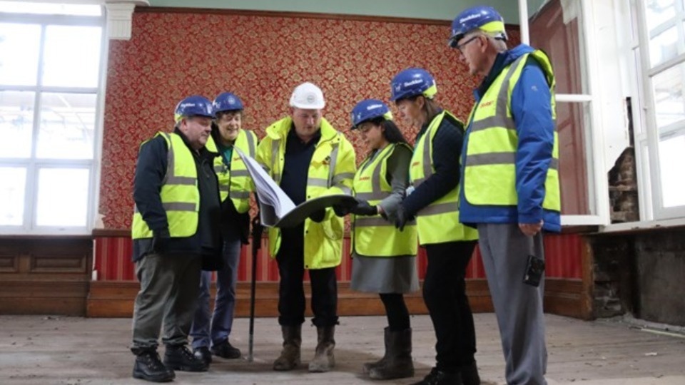 Oldham Council leader, Councillor Arooj Shah, is pictured (third from right) with some of the restoration team