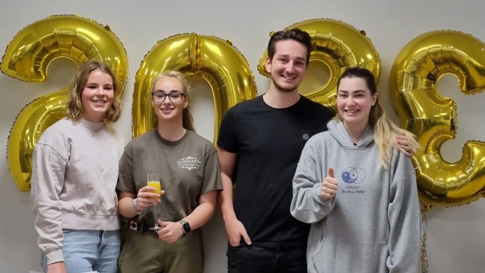 Robyn, Scarlett, Josh and Ella celebrate their successes at Oldham Hulme Grammar School. Images courtesy of OHGS