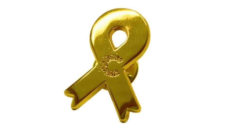 This September, show support and raise money for research into children’s and young people’s cancers by wearing a gold ribbon pin badge available from Cancer Research UK shops to mark Childhood Cancer Awareness Month This September, show support and raise money for research into children’s and young people’s cancers by wearing a gold ribbon pin badge available from Cancer Research UK shops to mark Childhood Cancer Awareness Month