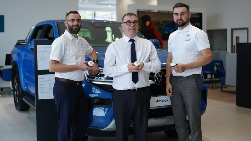 Staff at Oldham Volkswagen celebrate with a 20th anniversary cupcake Staff at Oldham Volkswagen celebrate with a 20th anniversary cupcake