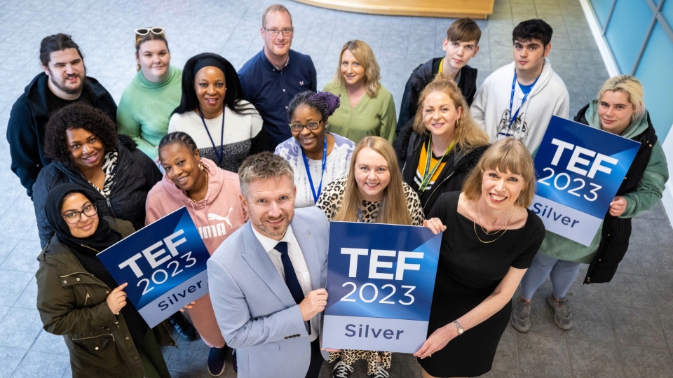 Flanked by UCO staff and learners, Susan Holden (Assistant Principal HE and Higher Skills at UCO) and Simon Jordan (Principal and Chief Executive at Oldham College) celebrate TEF Silver at the University Way site