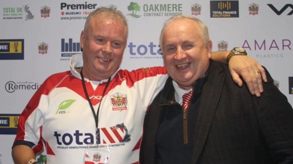 Pat Mulvihill is pictured with Oldham chairman Bill Quinn. Image courtesy of ORLFC