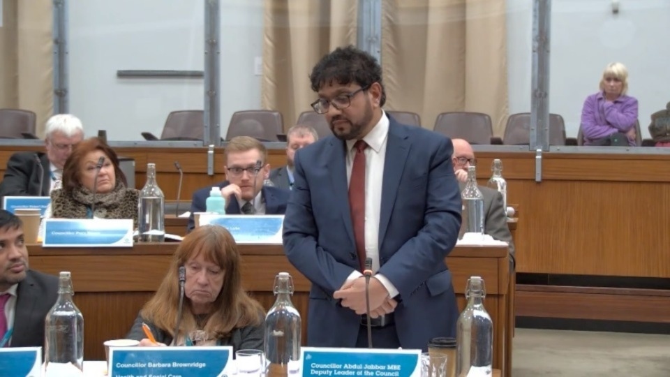 Councillor Abdul Jabbar, cabinet member for finance. Councillor Barbara Brownridge is seated next to him in the council chamber