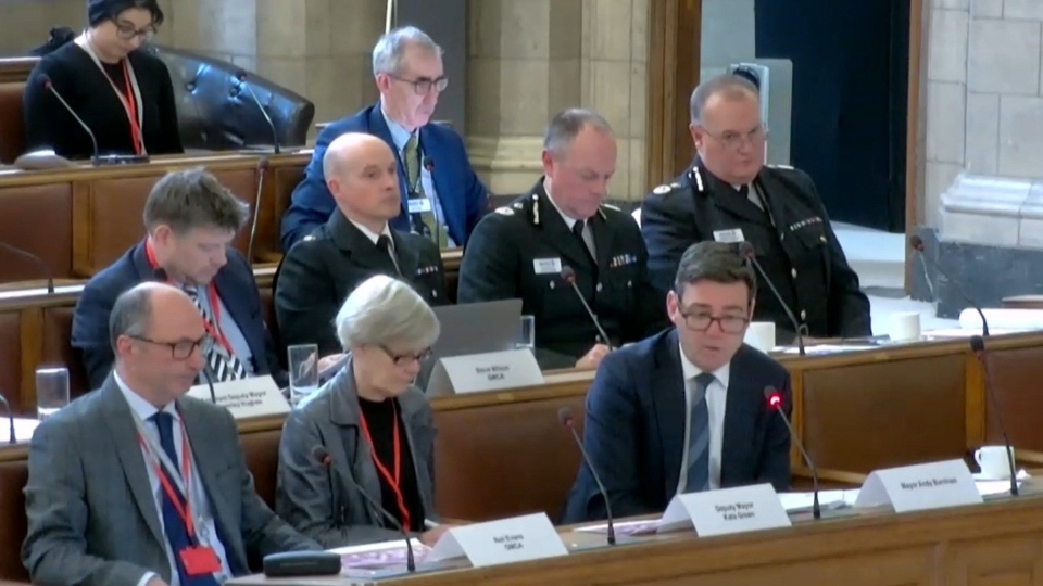 Greater Manchester mayor Andy Burnham pictured (front, right) at a Police, Fire and Crime Panel meeting last year