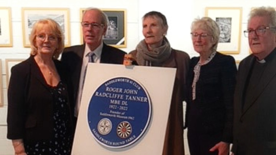 The plaque surrounded by Deputy Lieutenant Anne, husband Reverend Chaplain John and members of the Tanner family