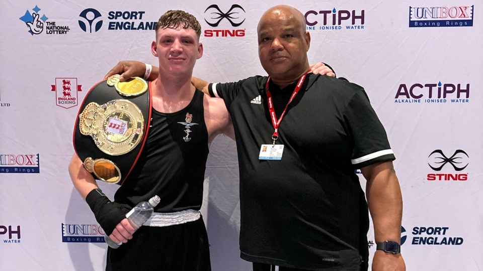 Oldham Boxing and Personal Development Centre founder, director and coach Eric Noi is pictured with Kyle Tullin