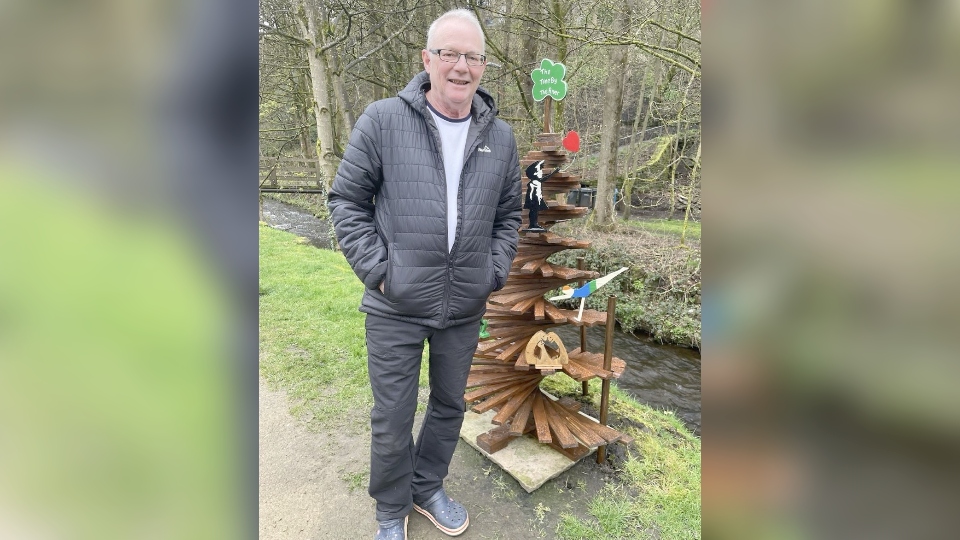 Retired joiner Chris Bannatyne pictured with the rebuilt tree