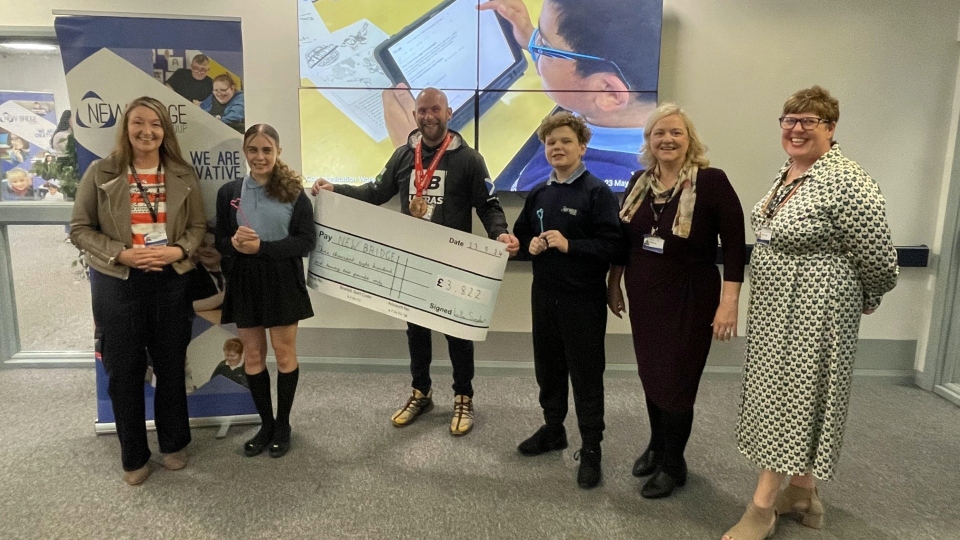 Luke visited New Bridge School to hand over a cheque for £3,822