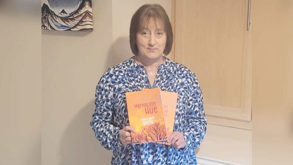 Oldham author Donna Marie Smith shows off a copy of Marmalade Hue Oldham author Donna Marie Smith shows off a copy of Marmalade Hue