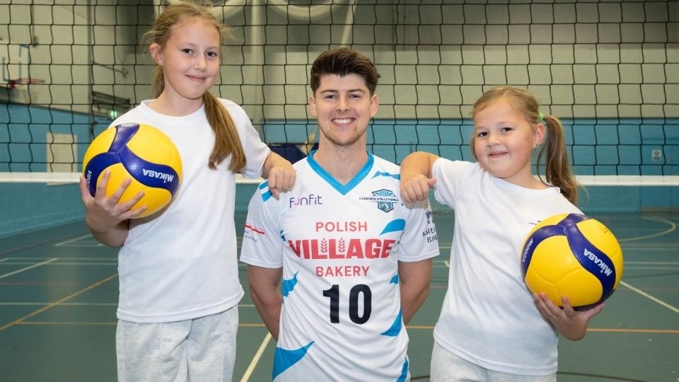 Ben Lucas (centre) is pictured with youth players Ola (left) and Iza (right)