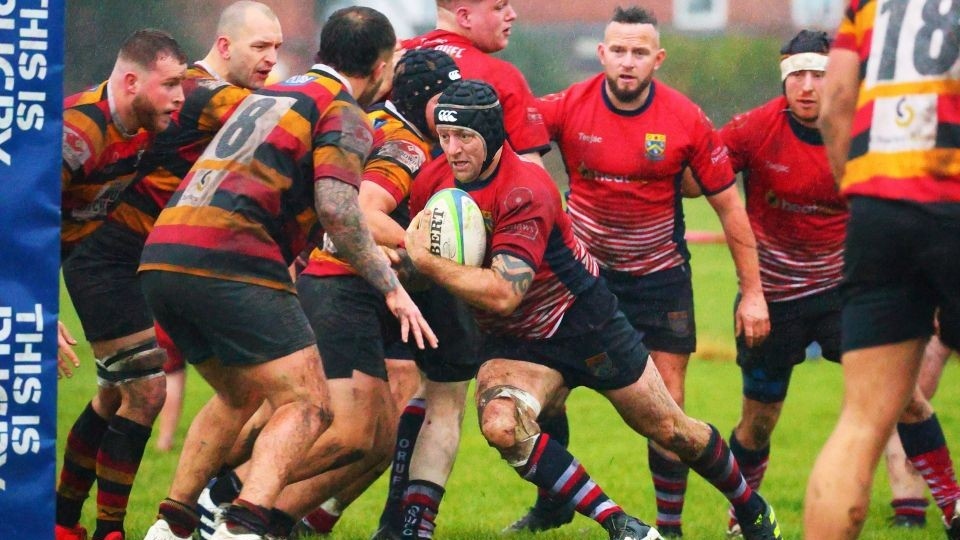 Josh Semple tries to make a break for Oldham. Image courtesy of Tim Abram