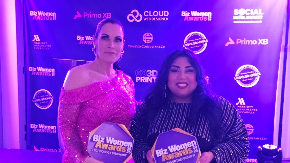 Felix Robinson presents Rubena with one of her Young Entrepreneur of the Year awards