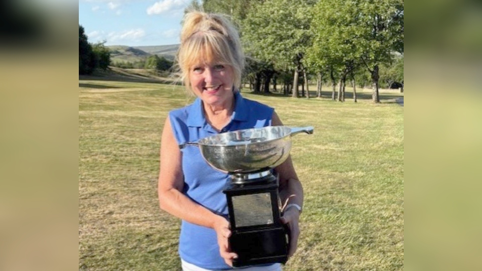 Brookdale golf club's Julie Evans shows off her trophy Brookdale golf club's Julie Evans shows off her trophy