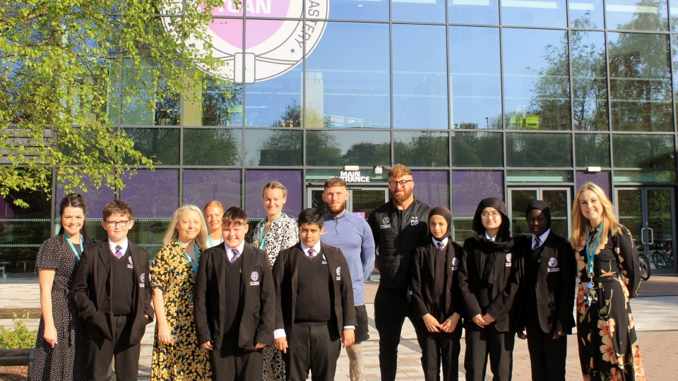 Staff and pupils from The Oldham Academy North are pictured outside the school Staff and pupils from The Oldham Academy North are pictured outside the school