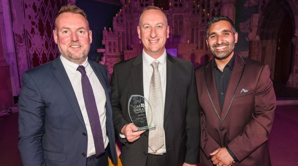 Pictured are Dave Cole, Head of HR at LWC, accepting the award alongside Baasit Siddiqui, host of this year’s GM Skills Awards (right), and David Lee, Sales Manager, Enterprise Learning and Skills (England) at Pearson U (left) Pictured are Dave Cole, Head of HR at LWC, accepting the award alongside Baasit Siddiqui, host of this year’s GM Skills Awards (right), and David Lee, Sales Manager, Enterprise Learning and Skills (England) at Pearson U (left)