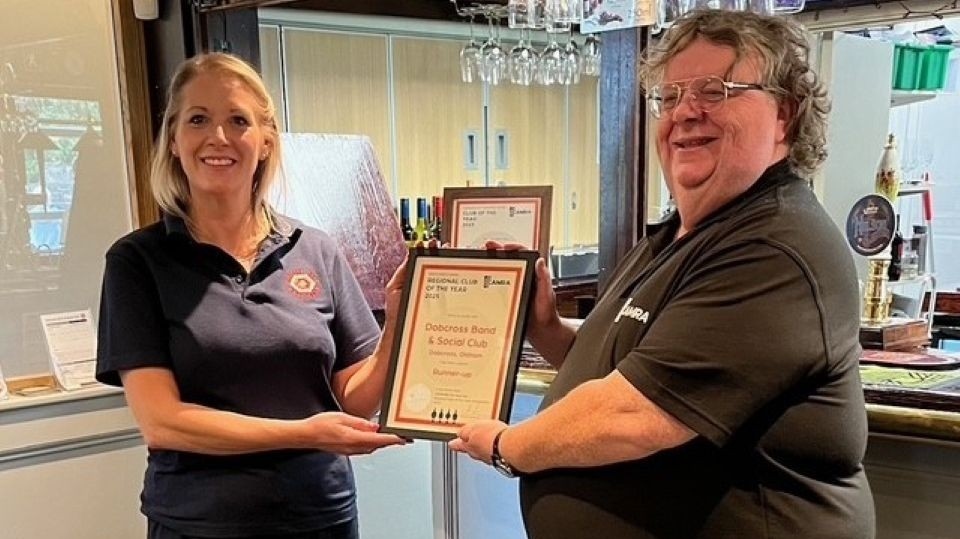 CAMRA’s Regional Director, Ralph Warrington, presenting the two awards to a very proud Adele Taylor