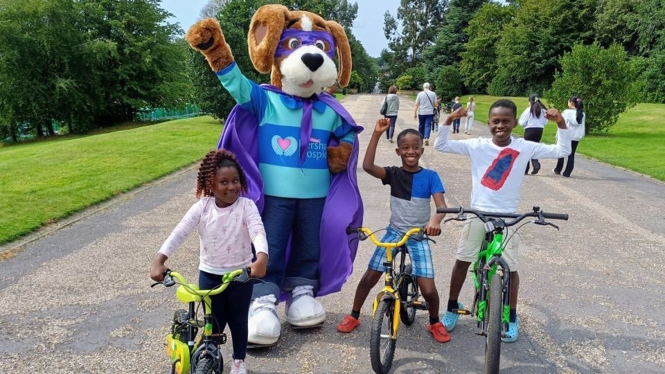 Hartley is pictured with children at Alexandra Park