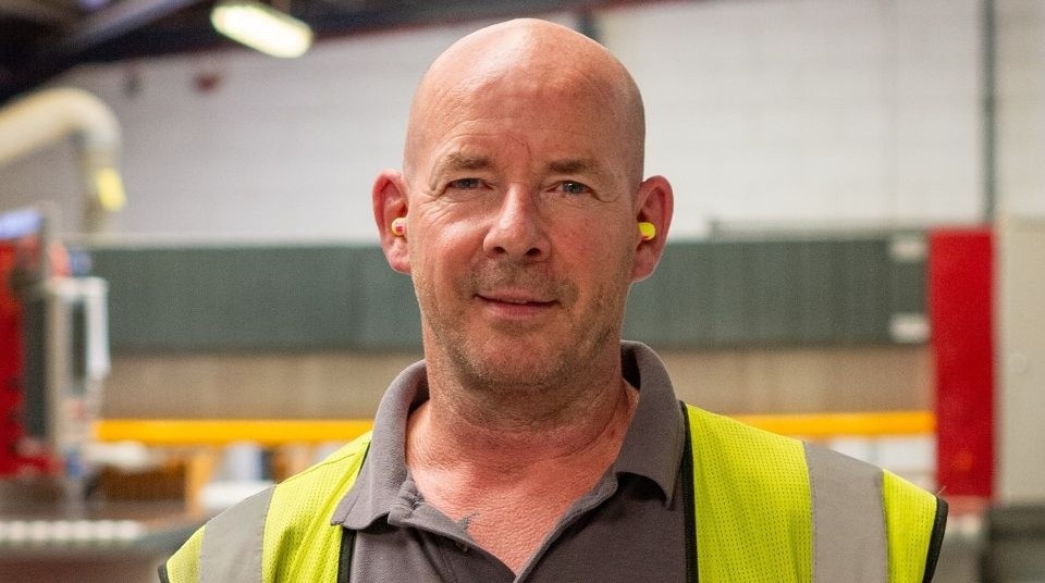 Jason Hilton with his 25-year service awards