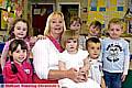 ANGELA KIRKHAM surrounded by some of the children who attend the nursery. Back row, from the left: Katie O’Brien, Bobbie Carey, Mia Ratcliffe, Hannah Penny, Kye Farrugia. Front: Erin Healer, Annabel Swindells and Jack Canny