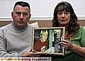 Jimmy and Susan Gray with a picture of their late son Mark, at the home in Middleton Road, Chadderton 