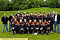 Higginshaw Eagles under-13s players, coaches, committee and sponsors line up before their tour to France. 