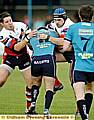 Ian Hodson (Left) and Mick Nanyn stop a Barrow attack in its tracks 