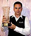 MARK POLLITT shows off the trophy.
