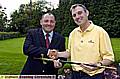 Tony Doidge, Royton and Crompton captain, presents Roger Smithies (right) with the Royton Sword. 