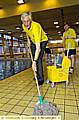 MICHAEL MEACHER mops up at the poolside at Oldham Sports Centre 
