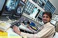 DR KUMAR with the X-ray system at the Royal Oldham Hospital 
