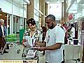 CONNECTING with the community . . . Afruz Miah speaks to a shopper 