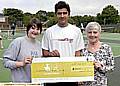 Top player Mohammad Shafique with the Lottery cheque for £8,000 for Clarksfield Tennis Club, and club member Philippa Hayes, left, and club chairman Kath Moss 
