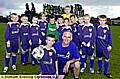 Paul Radcliffe and his son, Oliver, with the team sporting their new away kit 