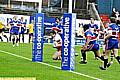 JAMES COYLE goes over under the posts for Oldham. 