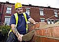 GOING up... Bricklayer John Winterbottom from Bramall Construction working on a Werneth property 