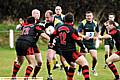 COLLISION COURSE: Andrew Sands (St Anne’s) takes on the Crosfields defence, marshalled by Matt Pitt. 