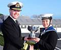Trainee Logistician Lorissa Seville receives the Sapphire Trophy from Rear Admiral Tony Johnstone-Burt, Commander of Joint Helicopter Command 