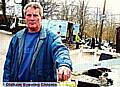 Diggle Hotel landlord Geoff Hibbert stands at one of the holes in Sam Road with National Grid workmen in the background 