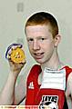 Thomas Stubbs shows off his medal. 