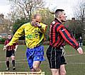 Warwick's Nicholas Foran and Bridge's Mike King in an aerial challenge. 