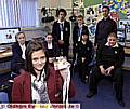 Local schoolchildren visit the City Learning Centre for BBC News School Report Day. Jessica Swales (Hathershaw) shows her Press card. 