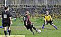 THIS TIME: Diggle ’keeper Mike Moore sets himself to stop Joe Rodney’s effort. 