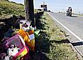 FAMILY flowers at the scene of the crash 